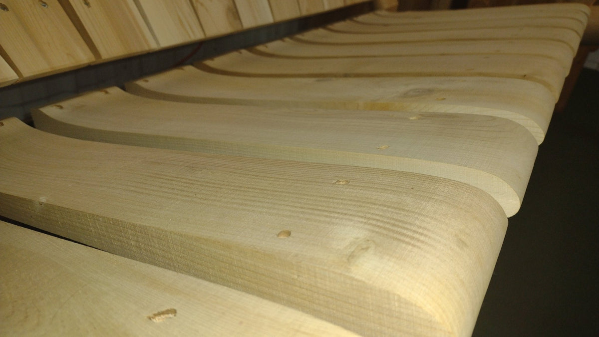 Smooth contoured seat slats of a log swing for enhanced comfort and durability